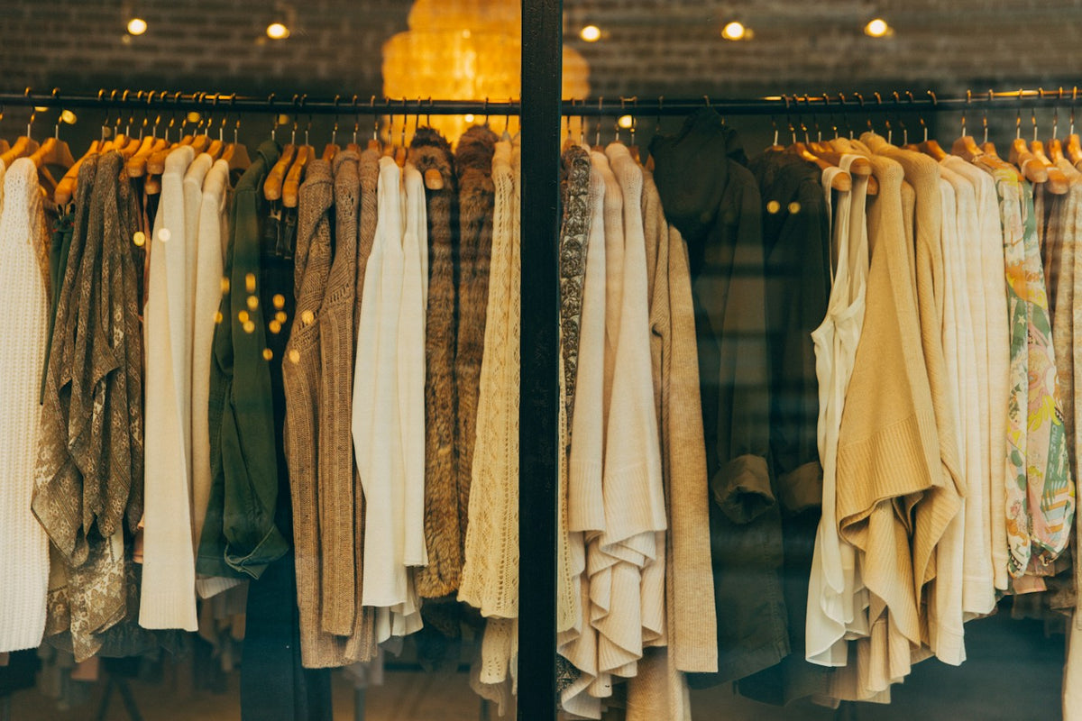 A curated clothing rail in warm neutral tones